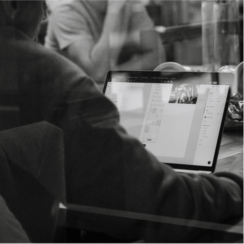 Website designer at work on a laptop at Vivo Group