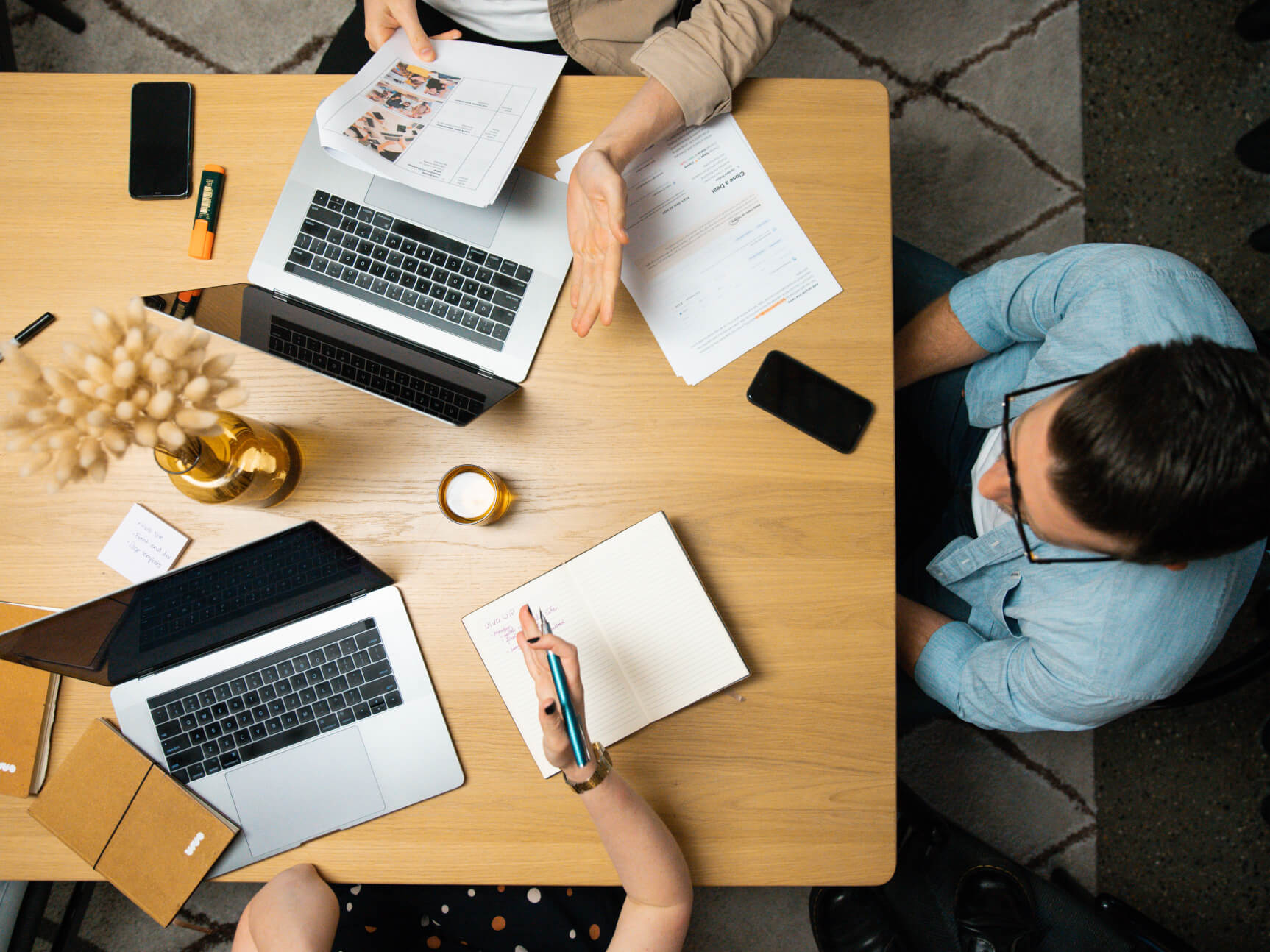 Creative director, web developer and designer collaborating on web design